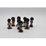 8 Robinsons jam Golly musicians hand painted, slight damage to some 7cm tall