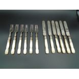 A set of six fruit knives and forks with Mother of Pearl handles