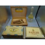 collection of cigars and a bottle of chocolate liquor