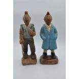 2 wooden Tintin figurines one walking, one in raincoat 32cm tall