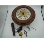 Circular wood framed wall clock, single weight with key and pendulum
