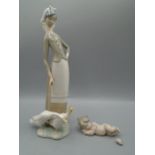 Lladro figures, one of lady with geese (geese head is missing) and little jesus with halo whose foot