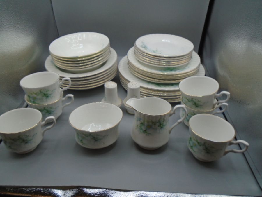 Royal Stafford part dinner service, white with flower design comprising of 6 dinner plates, 6 side