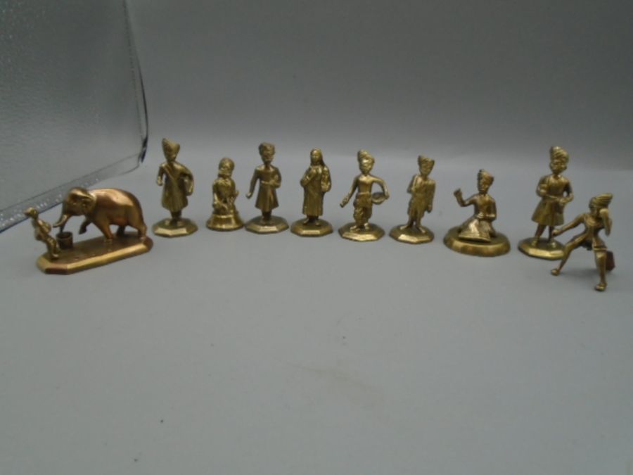 10 brass Indian figures one feeding elephant, possibly connected to chess