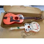 2 vintage Beatles Guitar toys. Largest is 80cm long approx. One is boxed. A/F