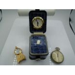 A Travel clock, a vintage stopwatch and a mini clock