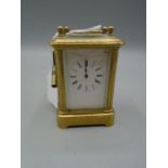A miniature french carriage clock by Depose Ab 2 3/4" high, bevelled glass, enamelled dial (slight