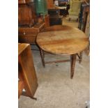 An 18th century oak gateleg drop-leaf table, the oval top raised on barley twist supports, the gates