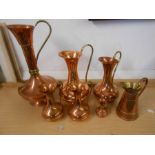 7 Copper jugs and 1 ceramic jug