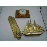 A Brass ships clock 'Barigo' 10cm approx. width of clock face. with a model of a sailing ship 25cm