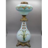 Blue ornate glass with brass oil lamp base