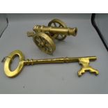 brass canon and large key