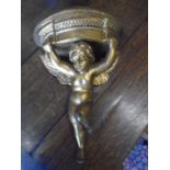 plaster cherub sconce, gold in colour