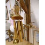 2 hanging wooden windchimes an owl and a dragon, look to be made from coconut husks