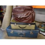 2 vintage suitcases and leather bag with a few other bags inside