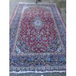 Quality vintage bordered rug, red with blue detail and leather bound edge 10ft3 x 6ft6