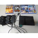 playstation 2 with 4 games and controllers