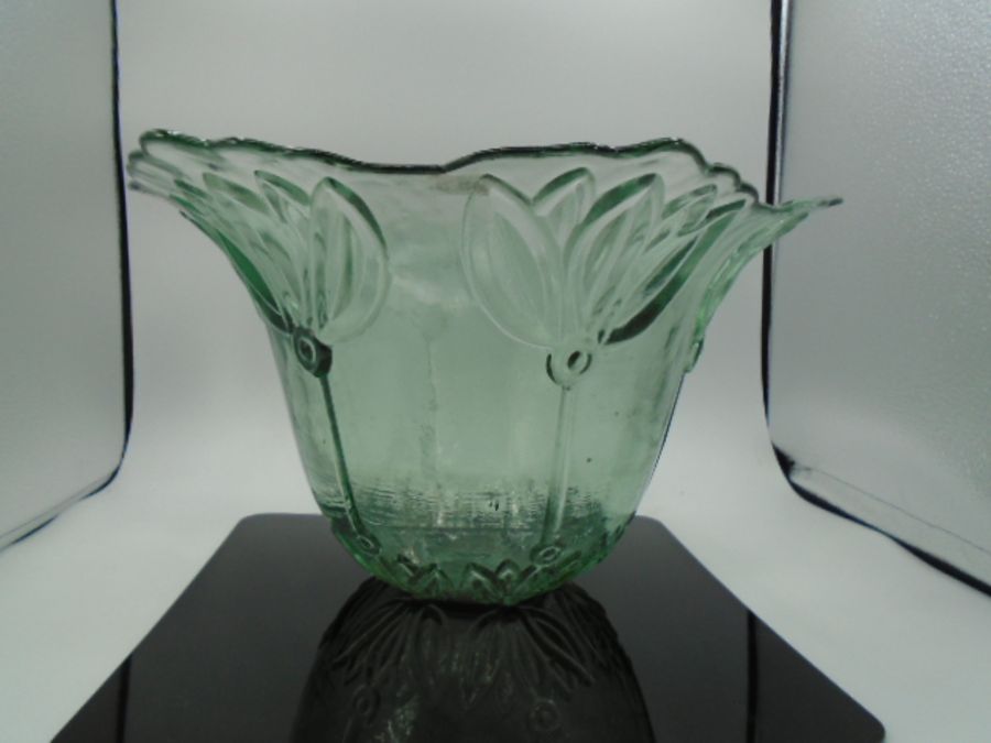 A large glass art deco style bowl 21 cm tall x 40cm at the widest point.