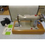 Bergstrom Gamages precision sewing machine, with pedal, manuals and case