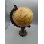 Globe on a wooden stand approx 33cm tall