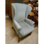 Wing backed armchair for reupholstery