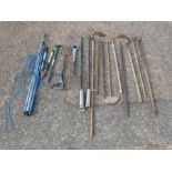 Quantity of garden tools including rakes, hoes, rotary clothes line etc