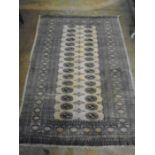 part silk? fawn and blue bordered rug 6ft 4" x 4ft w