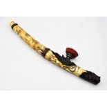 Chinese opium pipe, made of water buffalo bone, with engraved Chinese characters dragons and