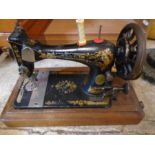 Vintage sewing machine in oak case