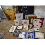 A large collection of framed pictures