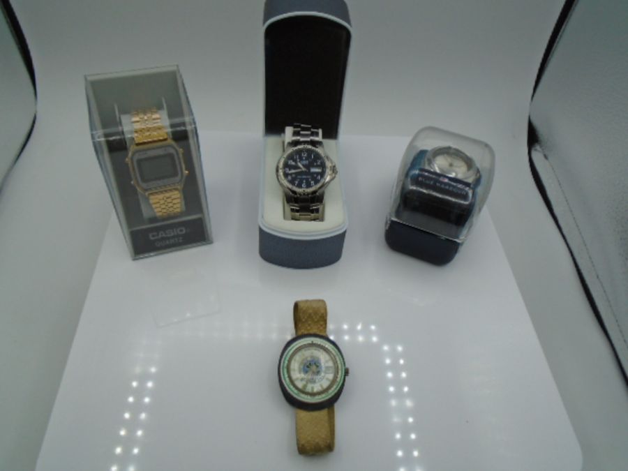 A boxed Blue Harbour watch, a boxed Casio Quartz watch, a boxed Lorus sports watch and a vintage