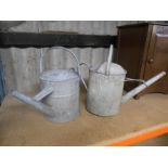 2 galvanised watering cans