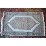 A wool and silk blended rug 167cm long by 92cm wide