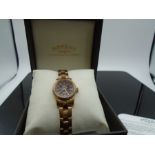 A boxed Ladies watch with guarantee (working order)