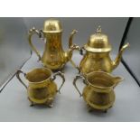 Brass teapot, coffee pot, milk jug and sugar bowl.