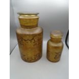 2 decorative glass jars with lids