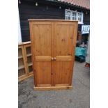 Two door solid pine wardrobe with internal shelving , 162cm H, 96cm W, 51cm D