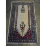 prayer mat? cream with red detail