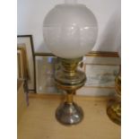Brass base oil lamp with decorative globe