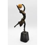 Art Deco style cast bronze figure of a dancing lady holding a ball, mounted on a black marble