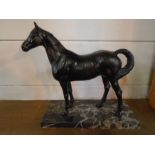 Metal cast figure of a horse on a marble base