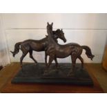 Bronzed statue of horses on a wooden base signed Rosa