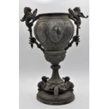 A Victorian spelter oil lamp base, in the form of a classical urn, moulded with lions and dragons,
