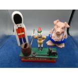 collection of money boxes- a metal 'trick dog' , Wade piggy bank and a soldier