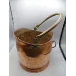 A copper coal scuttle