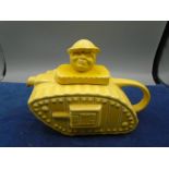 Sadler WWI novelty tank teapot in a yellow glaze with a Tommy finial