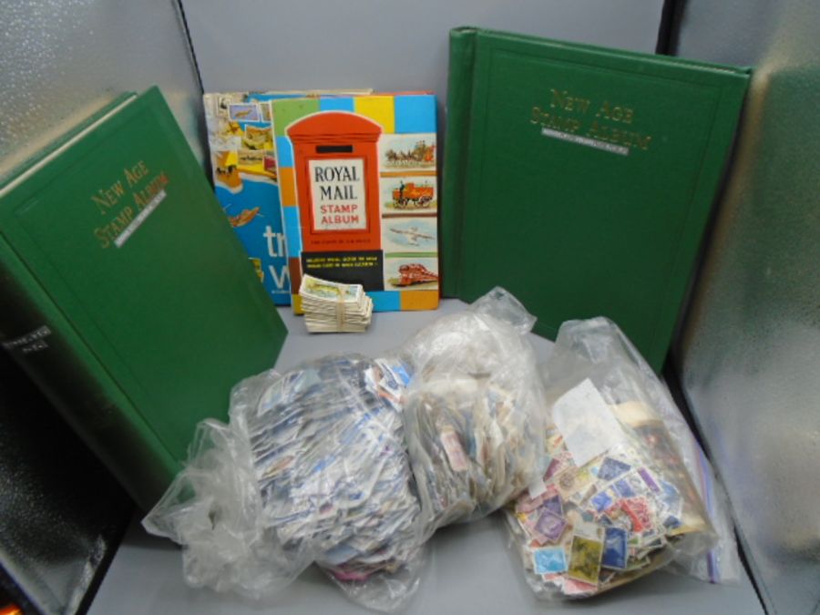 Stamp collectors albums, books,3 bags of loose used stamps, first day covers