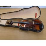 A Violin in case. no bow. Has 'stadivarious' sticker inside