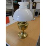Brass oil lamp with white glass shade