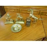 A brass horse figure, brass bookends, a brass dish depicting a horses head and a brass and leather
